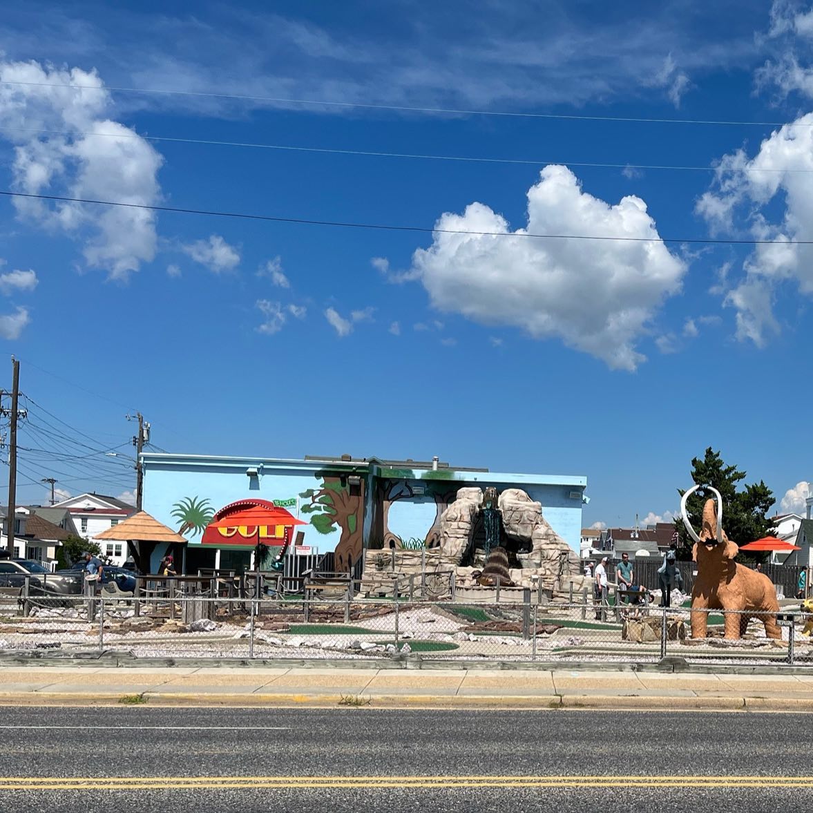 Jurassic Adventure Golf course with dinosaur statues and mammoth